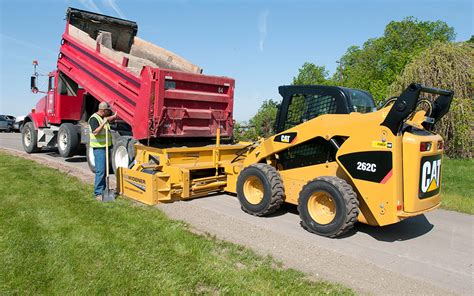 skid steer aggregate spreader|asphalt skid steer attachment.